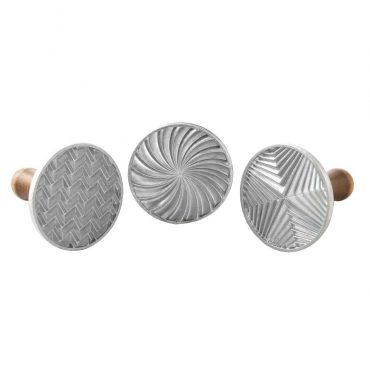 Three wooden-handled cookie stamps with geometric patterns - hexagon, triangle, and circle designs