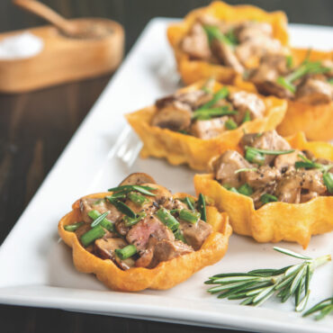 Golden-brown timbales filled with mushrooms and herbs, baked in Nordic Ware aluminum rosette molds
