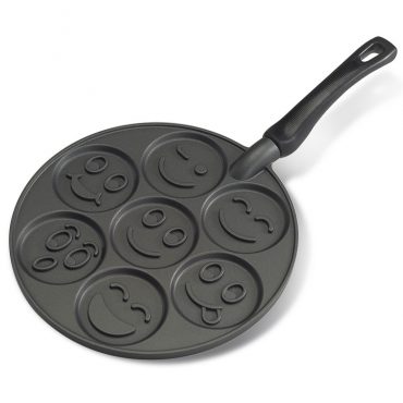 Nordic Ware aluminum pancake pan with seven round wells featuring raised smiley face designs, white background