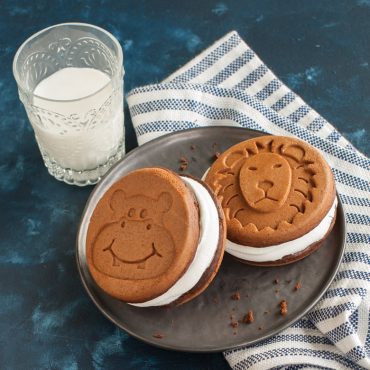 Zoo-shaped pancake sandwiches filled with white cream filling, made using Nordic Ware animal-shaped pancake pan