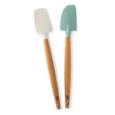 Two silicone spatulas - white spoonula and sea glass classic spatula with wooden handles on white background