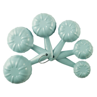 Set of 6 Nordic Ware Bundt measuring cups in translucent sea glass blue, nested together showing fluted exterior design