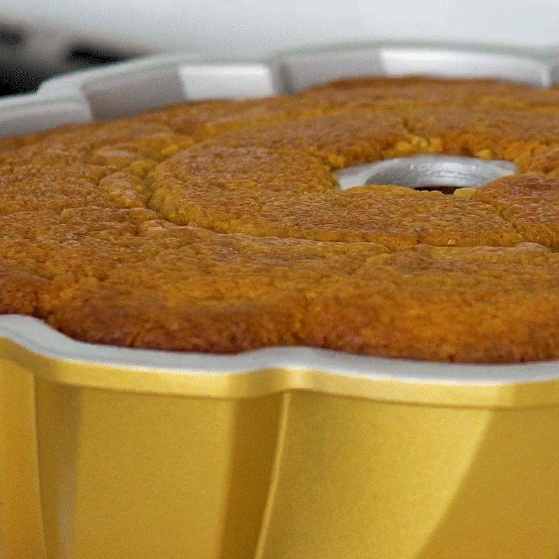 Nordic Ware digital bundt cake thermometer with probe inserted into golden baked bundt cake