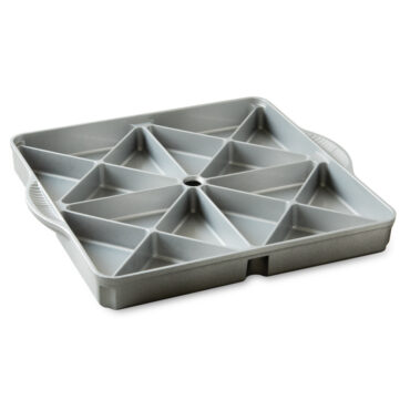 Nordic Ware aluminum mini scone pan with 8 triangular wells, natural silver finish, filled with golden baked scones