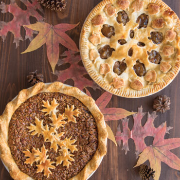 Nordic Ware aluminum pie top cutter with reversible leaf and apple pattern designs, silver finish