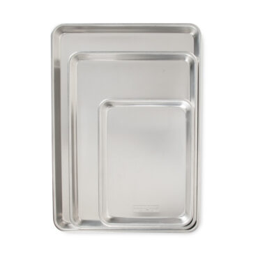 Nordic Ware Naturals aluminum baking sheet set showing three rectangular pans in graduated sizes with natural finish