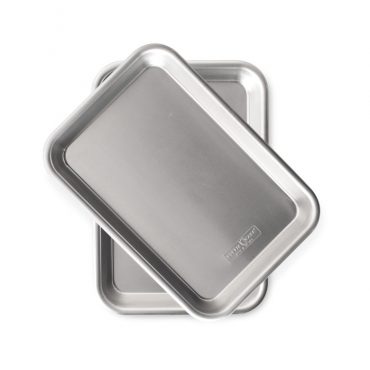 Two Nordic Ware aluminum eighth sheet pans with raised rims and built-in handles, natural silver finish