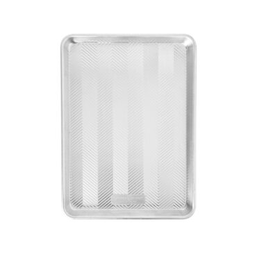 Nordic Ware Prism aluminum half sheet pan with textured chevron pattern bottom and raised edges