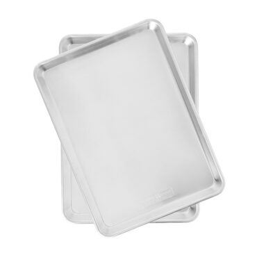 Two Nordic Ware Naturals aluminum half sheet pans stacked, rectangular with raised rims, natural silver finish
