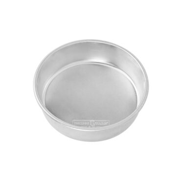 Nordic Ware aluminum 8-inch round layer cake pan, natural silver finish, angled view showing interior depth