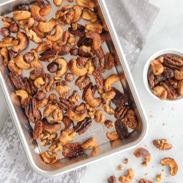 Nordic Ware aluminum eighth sheet pan with golden roasted mixed nuts, natural finish with raised rim