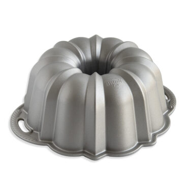 Nordic Ware Silver Anniversary aluminum bundt pan with intricate fluted design and silver finish