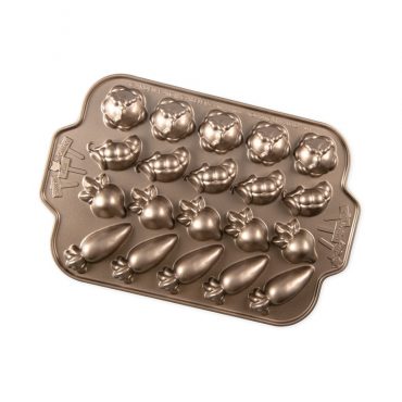 Nordic Ware aluminum cakelet pan with 20 vegetable-shaped cavities: cabbages, pea pods, radishes, and carrots