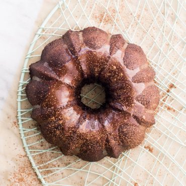 Nordic Ware 6-cup cast aluminum bundt pan with fluted design, natural silver finish, overhead view