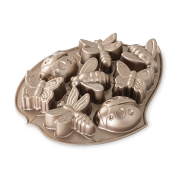 Nordic Ware Backyard Bugs aluminum baking pan with insect-shaped cavities, bronze metallic finish