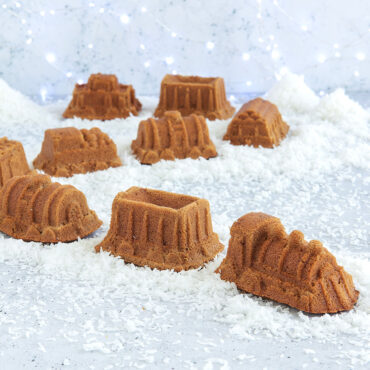Golden baked train cake from Nordic Ware train cake pan, showing locomotive and cars with detailed molded features