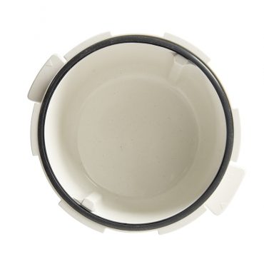 Black rubber gasket ring positioned on silver aluminum Nordic Ware Tender Cooker base, overhead view