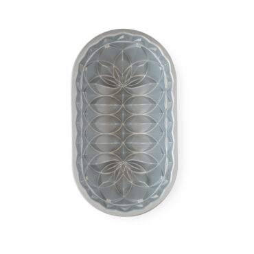 Nordic Ware aluminum Jubilee loaf pan interior showing decorative geometric and floral pattern, silver finish