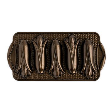 Nordic Ware bronze aluminum corn cakes baking pan with 5 ear-shaped cavities, overhead view