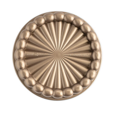 Nordic Ware Charlotte aluminum cake pan in toffee finish, round with fluted sides and center tube