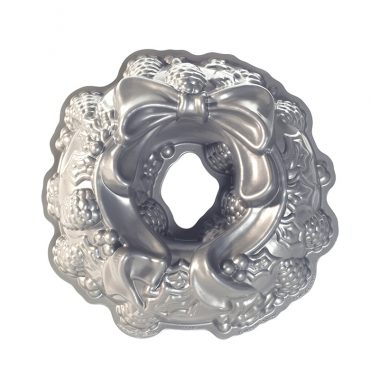 Nordic Ware aluminum Holiday Wreath bundt pan with decorative holly leaf and berry pattern, silver finish