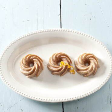Nordic Ware Heritage Bundtlette aluminum baking pan with six individual fluted bundt cavities, silver finish