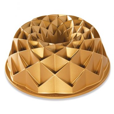 Nordic Ware aluminum Jubilee bundt pan with geometric diamond pattern design, gold-colored finish