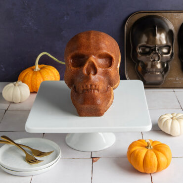 Haunted Skull Cake on white cake stand