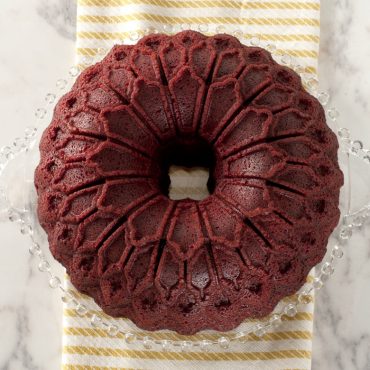 Red velvet bundt cake in Nordic Ware Stained Glass bundt pan showing geometric faceted design pattern