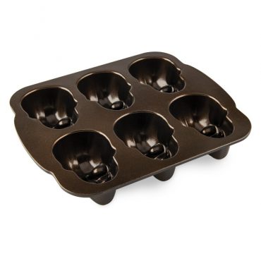 Nordic Ware Haunted Skull Cakelet Pan showing 6 detailed skull-shaped cavities with bronze nonstick interior coating