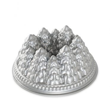 Nordic Ware Pine Forest Bundt pan with detailed tree and pinecone design, aluminum construction, natural finish