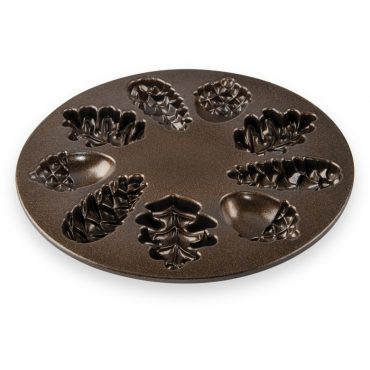 Nordic Ware Woodland Cakelet pan interior showing bronze nonstick coating and six tree-shaped cavities