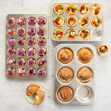 Three Nordic Ware aluminum muffin pans in natural silver finish: jumbo 6-cup, standard 12-cup, and mini 24-cup sizes