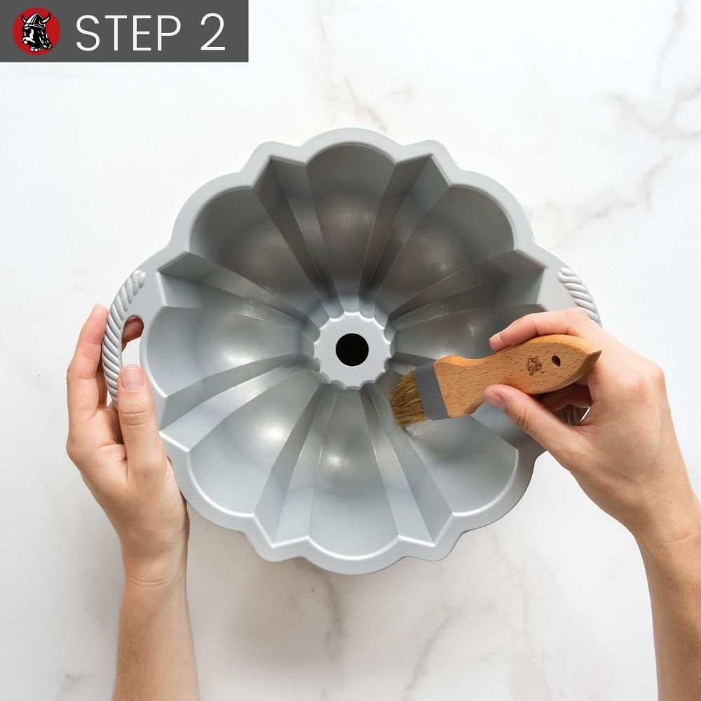Step 2 Hand using brush to evenly coat Bundt Pan