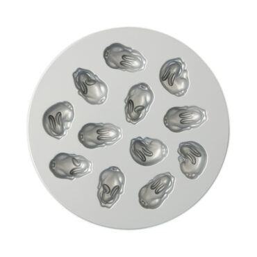 Nordic Ware aluminum bunny-shaped cakelet pan interior showing six detailed rabbit molds with textured fur patterns