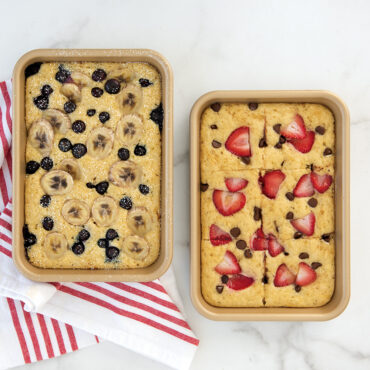 Two Nordic Ware aluminum eighth sheet pans with golden mini pancakes, natural finish with raised rims