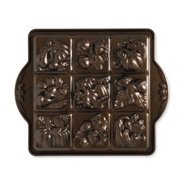 Nordic Ware aluminum Seasonal Squares baking pan with 9 square cavities featuring seasonal designs, natural finish