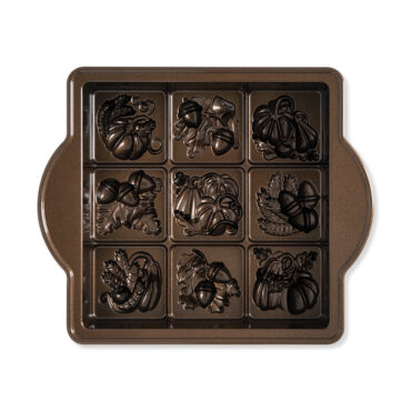 Nordic Ware aluminum Seasonal Squares baking pan with 12 square cavities featuring seasonal motifs, natural finish