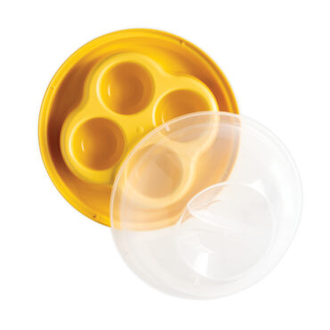 Nordic Ware white aluminum egg bites pan with 7 round wells, glass lid partially covering pan
