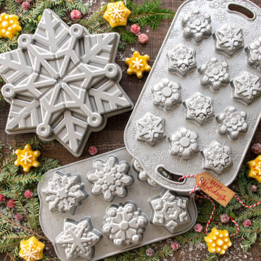 Nordic Ware aluminum snowflake-shaped baking pan with detailed fluted design, natural silver finish