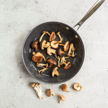 Basalt 10in Skillet lifestyle image with mushrooms in pan, overhead