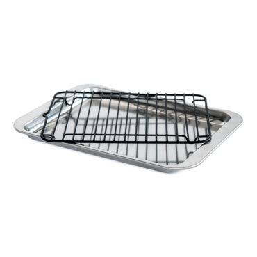 Nordic Ware aluminum broiler set with wire rack positioned on rectangular baking sheet, natural silver finish