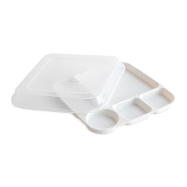 White rectangular divided dinner tray with three compartments containing colorful prepared foods