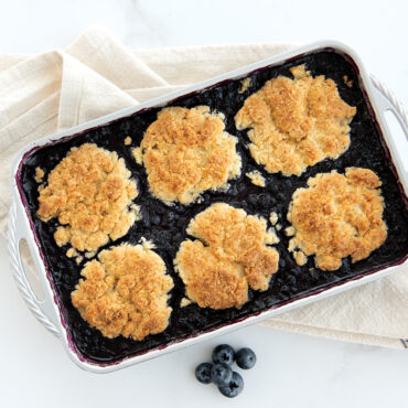 Golden berry cobbler with biscuit topping in Nordic Ware ProCast rectangular aluminum baking pan