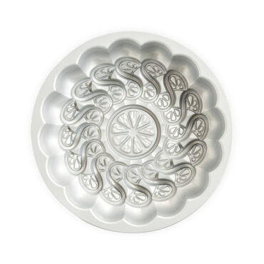 Nordic Ware Citrus Twist aluminum bundt pan interior view showing detailed spiral fluted design, silver finish