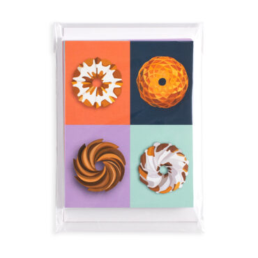 Nordic Ware Bundt greeting cards set in clear plastic packaging, featuring colorful bundt cake designs