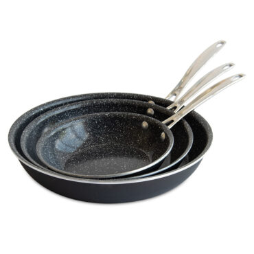 Three Nordic Ware Basalt ceramic skillets in dark gray, nested together showing 8, 10, and 12 inch sizes