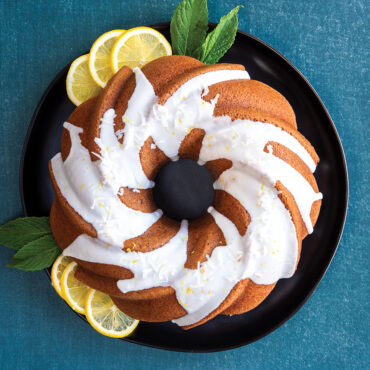 Glazed bundt cake in Nordic Ware aluminum Swirl bundt pan, showing elegant spiral ridged pattern