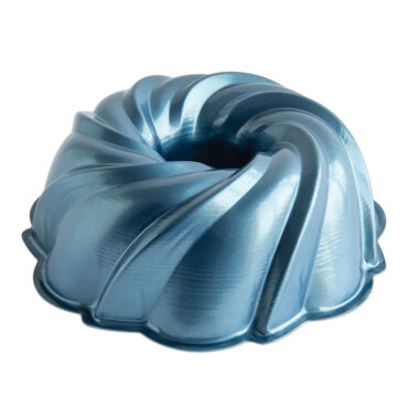 Nordic Ware aluminum bundt pan with decorative swirl pattern, silver finish, empty and ready for baking