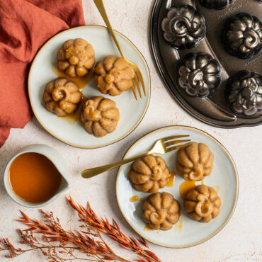 Pumpkin Cakelets on small plates with caramel drizzle, overhead